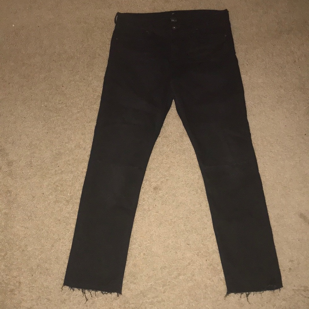 Black jeans with rips in knee